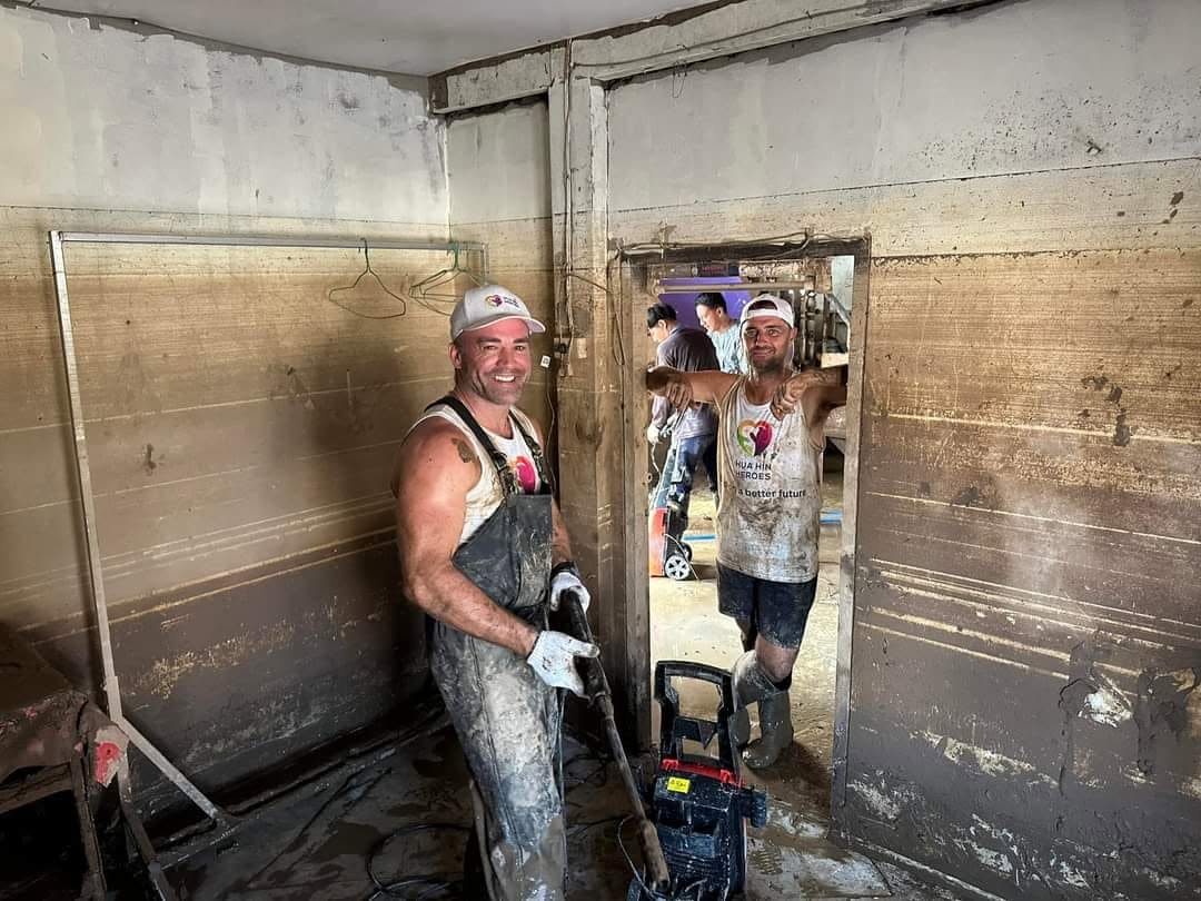 Clearing mud from a flooded home