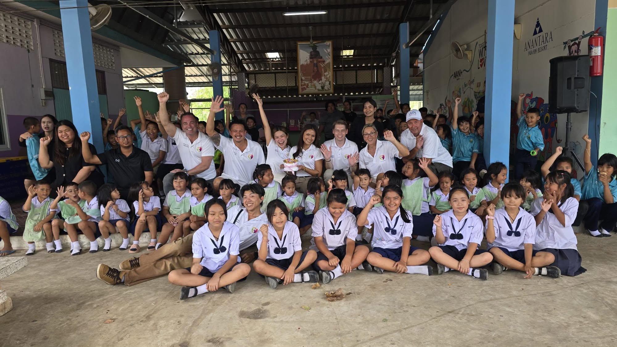 Volunteers with students during a school visit